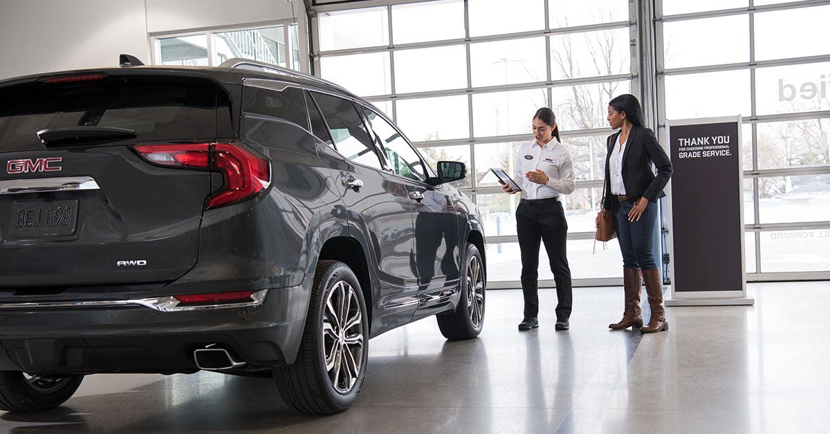 customer speaking to salesperson in dealership